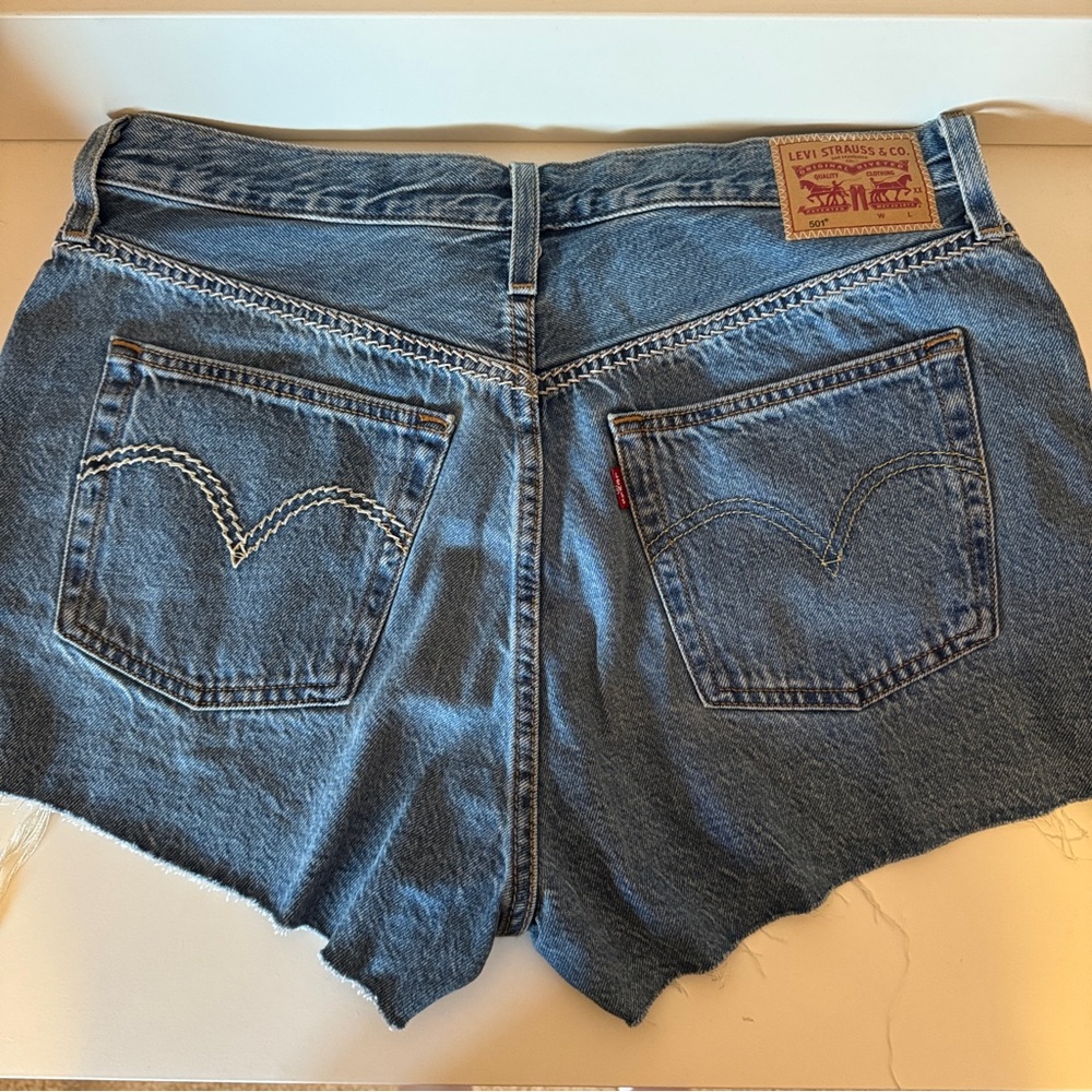 Levi's Blue Jean Shorts with Raw Hem and Distressed Finish